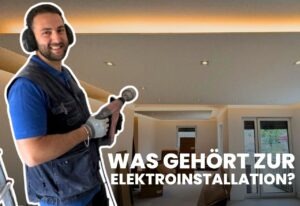 Mann mit Bohrer im Raum, Elektroinstallation Thema.